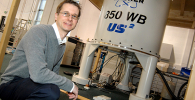 Photo of Steven Brown with NMR spectrometer